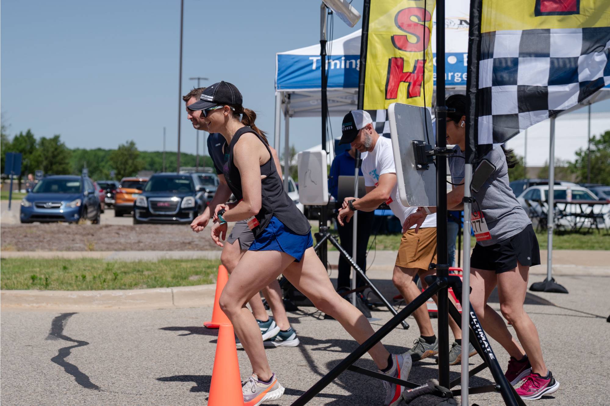 Brent Tavis, Lindsey DesArmo, and other GVSU employees beginning their run at the starting line of the 2024 GVPD race